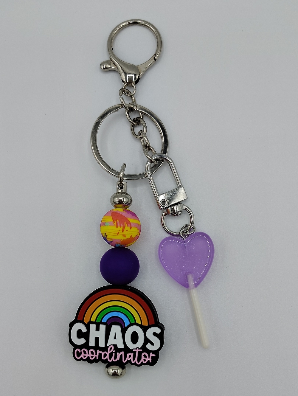 Handcrafted "Chaos Coordinator" Rainbow Keychain w/ Purple Heart Lollipop Charm